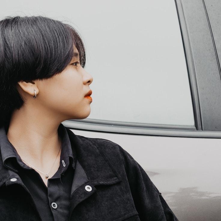 Kaveri Mehta, Lead Design Curator at ValleyRippleTone, reviewing corporate floral arrangements